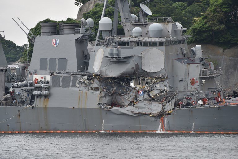 This photo shows damages on the guided missile destroyer USS Fitzgerald at its mother port in Yokosuka, southwest of Tokyo on June 18, 2017. 
A number of missing American sailors have been found dead in flooded areas of a destroyer that collided with a container ship off Japan's coast, the US Navy said on June 18, 2017. / AFP PHOTO / Kazuhiro NOGI
