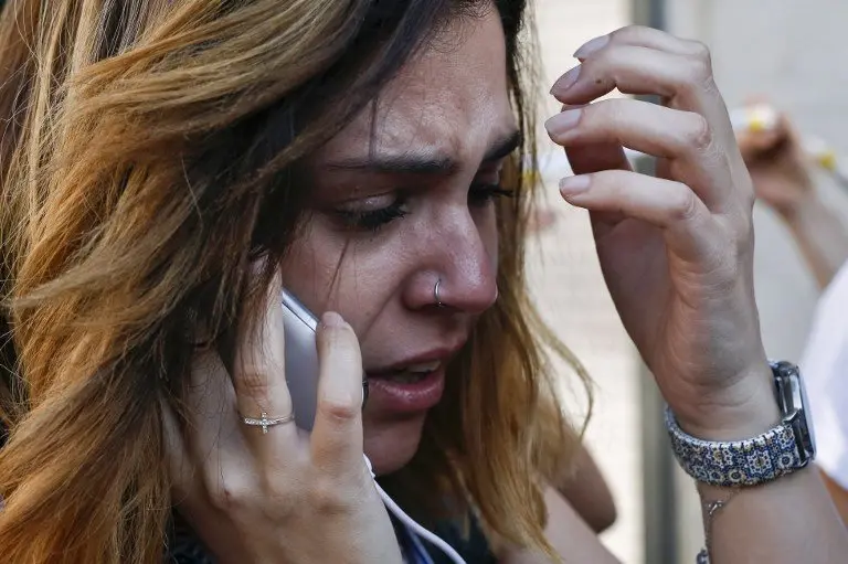 A woman cries as she phones after a van ploughed into the crowd, killing one person and injuring several others on the Rambla in Barcelona on August 17, 2017.
Police in Barcelona said they were dealing with a "terrorist attack" after a vehicle ploughed into a crowd of pedestrians on the city's famous Las Ramblas boulevard on August 17, 2017. Police were clearing the area after the incident, which has left a number of people injured. / AFP PHOTO / Pau Barrena