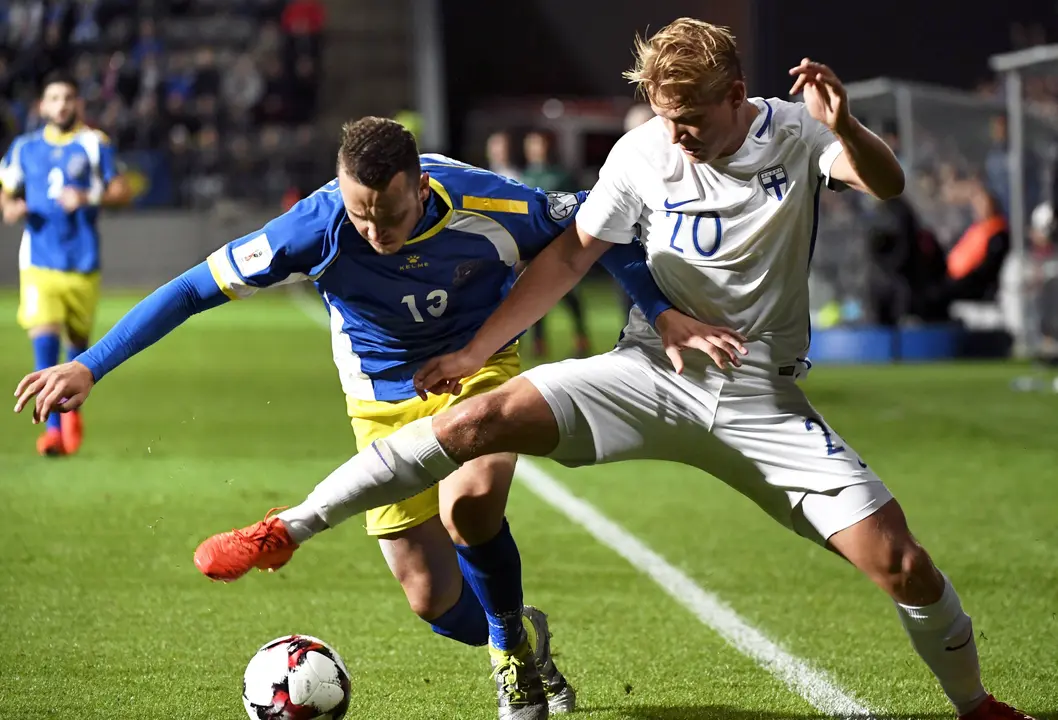 Joel Pohjanpalo of Finland (R) vies with Albert Bunjaku of Kosovo during the World Cup 2018 qualifying football match Finland vs Kosovo on September 5, 2016 in Turku. / AFP PHOTO / Lehtikuva / Jussi Nukari / Finland OUT