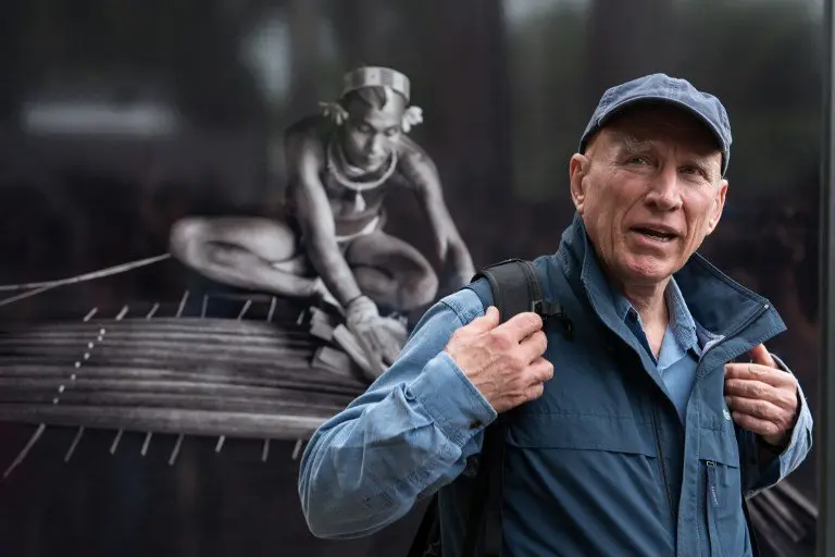 (FILES) This file photo taken on May 27, 2013 shows Brazilian photographer Sebastiao Salgado walking around his pictures which are part of the exhibition "Genesis", ready to be opened to the public at the Environment Museum of Rio de Janeiro's Botanic Garden, on May 27, 2013. / AFP PHOTO / YASUYOSHI CHIBA