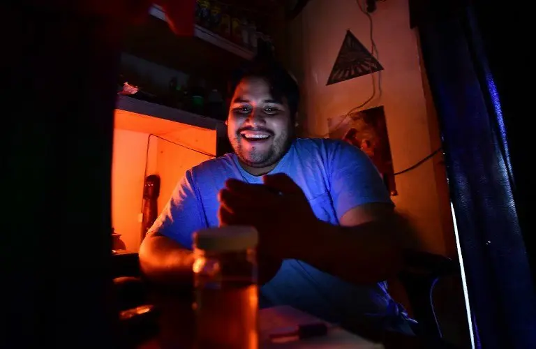 Lazaro Paz, owner and healer at Botanica Julika, sits in his office in Los Angeles on November 4, 2016. 
Paz is seeing an unusual request from his costumer: calm their anxiety about US Republican presidential candidate Donald Trump and his immigration policy.  / AFP PHOTO / Frederic J. Brown