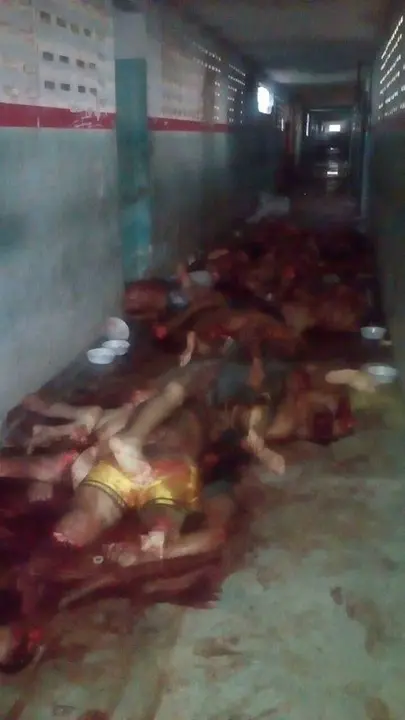 Handout picture taken with a cell phone by a PM militarized police officer showing the corpses of the inmates killed in a riot in the PAMC (Agricola de Monte Cristo Penitentiary) in Roraima, northern Brazil on January 6, 2017.
At least 33 inmates were killed by their rivals at a prison in northern Brazil on Friday, days after a riot by warring gangs left dozens more dead at another prison, officials said. / AFP PHOTO / HO / GRAPHIC CONTENT
