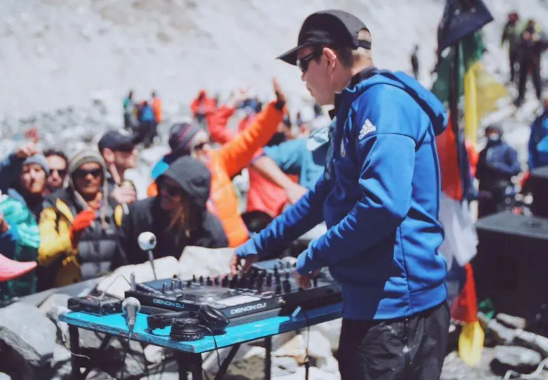 British DJ Paul Oakenfold plays a set to mountaineers and trekkers at Everest base camp on April 11, 2017.
Top British DJ Paul Oakenfold braved thinning air and freezing temperatures to host the "highest party on earth" at Everest base camp on April 11, playing to around 100 climbers -- all in full mountain gear. The 53-year-old artist, who trekked for 10 days to reach base camp, mixed his beats on a makeshift stone stage set against the spectacular backdrop of the world's highest mountains. XGTY / RESTRICTED TO EDITORIAL USE - MANDATORY CREDIT "AFP PHOTO / ANTON NELSON / SOUNDTREK" - NO MARKETING NO ADVERTISING CAMPAIGNS - DISTRIBUTED AS A SERVICE TO CLIENTS / AFP PHOTO / Paul Oakenfold's SoundTrek / Anton NELSON / XGTY / RESTRICTED TO EDITORIAL USE - MANDATORY CREDIT "AFP PHOTO / ANTON NELSON / SOUNDTREK" - NO MARKETING NO ADVERTISING CAMPAIGNS - DISTRIBUTED AS A SERVICE TO CLIENTS