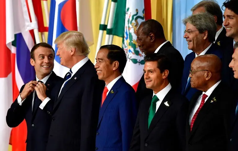 (1st row L-R) French President Emmanuel Macron, US President Donald Trump, Indonesia's President Joko Widodo, Mexico's President Enrique Pena Nieto, South Africa's President Jacob Zuma pose for a family photo of the participants of the G20 summit in Hamburg, northern Germany on July 7, 2017.
Leaders of the world's top economies gather from July 7 to 8, 2017 in Germany for likely the stormiest G20 summit in years, with disagreements ranging from wars to climate change and global trade. / AFP PHOTO / Tobias SCHWARZ