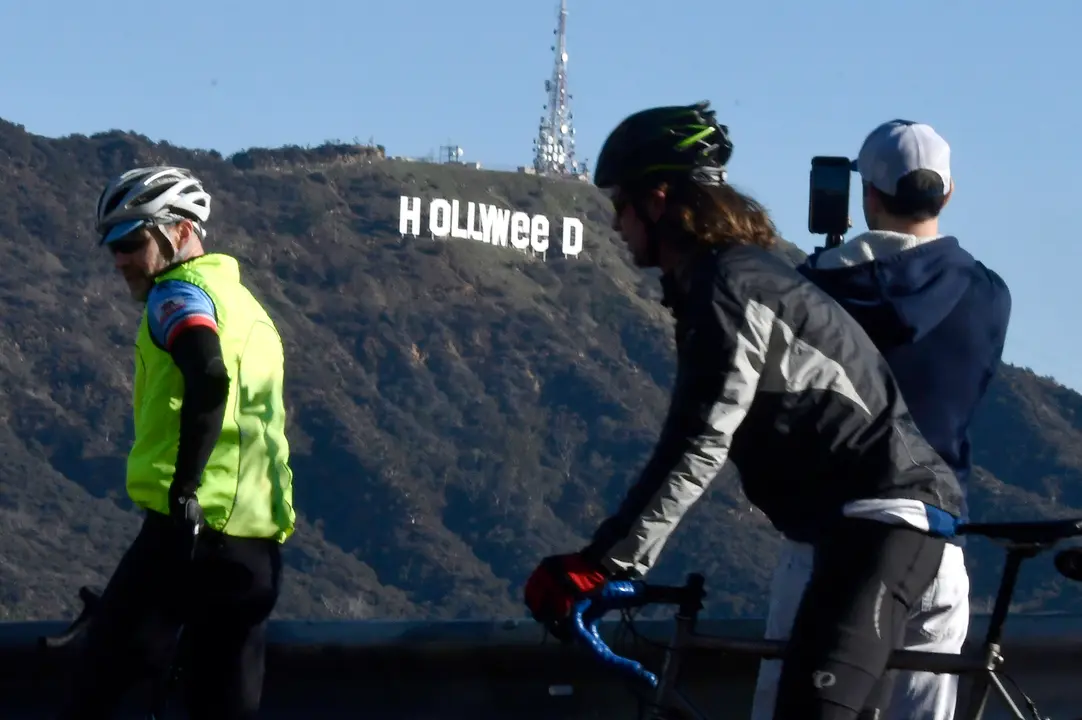 The famous Hollywood sign reads "Hollyweed" after it was vandalized, January 1, 2017.  
Police said unidentified thrill-seekers had climbed up and arranged tarps over the two letter "O's" to make them look like "E's," CBS affiliate KCAL reported. Each letter is 45 feet (13.7 meters) high, so the feat would have required not just bravado but considerable athleticism. 
 / AFP PHOTO / Gene Blevins