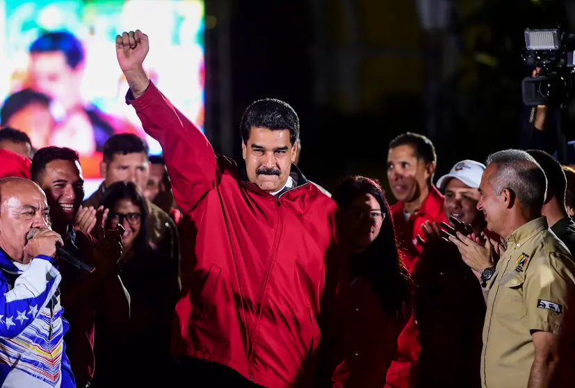 Venezuelan president Nicolas Maduro celebrates the results of "Constituent Assembly", in Caracas, on July 31, 2017.
Deadly violence erupted around the controversial vote, with a candidate to the all-powerful body being elected shot dead and troops firing weapons to clear protesters in Caracas and elsewhere. / AFP PHOTO / RONALDO SCHEMIDT