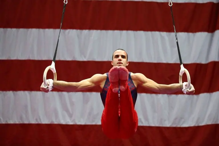 <p>El gimnasta estadounidense Danell Leyva realiza una rutina en aros durante las competencias preparatorias para los Juegos Olímpicos el 23 de junio de 2016 en San Luis</p>