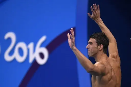 USA's Michael Phelps celebrates after USA won the Men's swimming 4 x 100m Medley Relay Final at the Rio 2016 Olympic Games at the Olympic Aquatics Stadium in Rio de Janeiro on August 13, 2016. / AFP PHOTO / Martin BUREAU