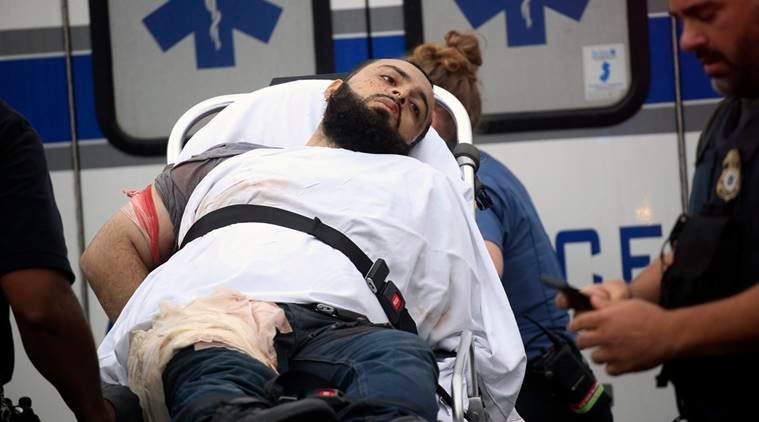 Ahmad Khan Rahami is taken into custody after a shootout with police Monday, Sept. 19, 2016, in Linden, N.J. Rahami was wanted for questioning in the bombings that rocked the Chelsea neighborhood of New York and the New Jersey shore town of Seaside Park. (Nicolaus Czarnecki/Boston Herald via AP) /The Boston Herald via AP)