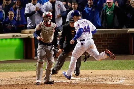 CHICAGO, IL - OCTOBER 30: Anthony Rizzo #44 of the Chicago Cubs scores a run past Roberto Perez #55 of the Cleveland Indians in the fourth inning in Game Five of the 2016 World Series at Wrigley Field on October 30, 2016 in Chicago, Illinois. Jamie Squire/Getty Images/AFP
