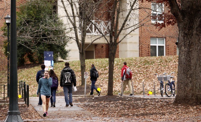 CHARLOTTESVILLE, VA - DECEMBER 6: Students walk through the University of Virginia campus on December 6, 2014 in Charlottesville, Virginia. On Friday, Rolling Stone magazine issued an apology for discrepencies that were published in an article regarding the alleged gang rape of a University of Virginia student by members of the Phi Kappa Psi fraternity.   Jay Paul/Getty Images/AFP