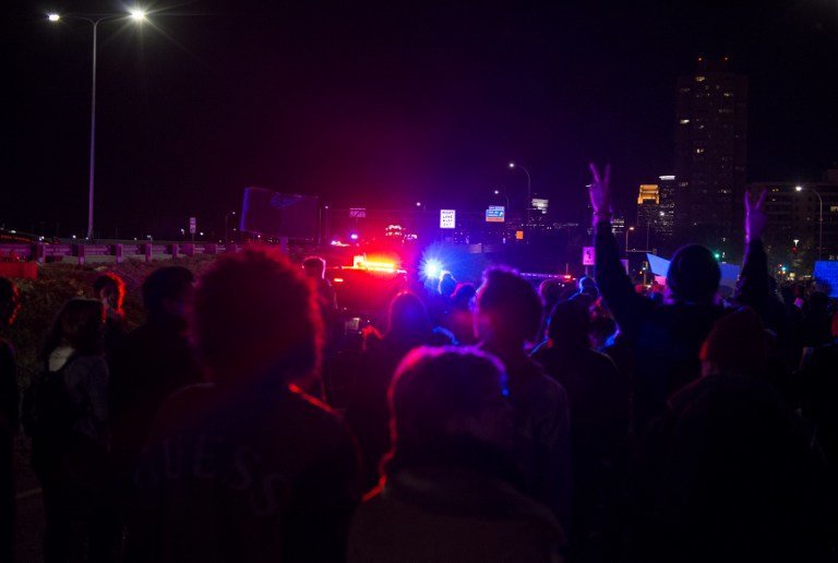 MINNEAPOLIS, MN - NOVEMBER 10: Police block protesters of President-elect Donald Trump from marching after they blocked traffic on I-94 on November 10, 2016 in Minneapolis, Minnesota. Thousands of people across the country have taken to the streets in protest in the days following the election of Republican Donald Trump over Democrat Hillary Clinton.   Stephen Maturen/Getty Images/AFP