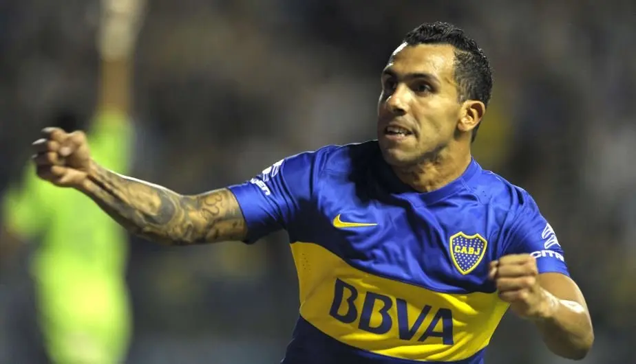 Boca's footballer Carlos Tevez celebrates after scoring against Newells during their Argentina First Division football match at La Bombonera stadium, in Buenos Aires, Argentina, on February 20, 2016. AFP PHOTO / ALEJANDRO PAGNI
