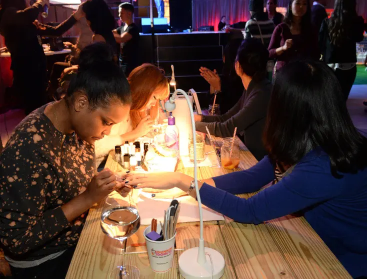 NEW YORK, NY - JANUARY 29: Guests enjoy Smirnoff Ice and a Nail Salon at the Ladies With Game Tailgate at The Diageo Liquid Cellar on January 29, 2014 in New York City. (Photo by Rick Diamond/Getty Images for Smirnoff Ice)