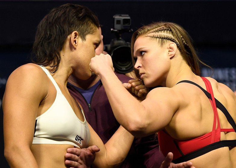 LAS VEGAS, NV - DECEMBER 29:  (L-R) UFC women's bantamweight champion Amanda Nunes of Brazil and Ronda Rousey face off during the UFC 207 weigh-in at T-Mobile Arena on December 29, 2016 in Las Vegas, Nevada. (Photo by Josh Hedges/Zuffa LLC/Zuffa LLC via Getty Images)