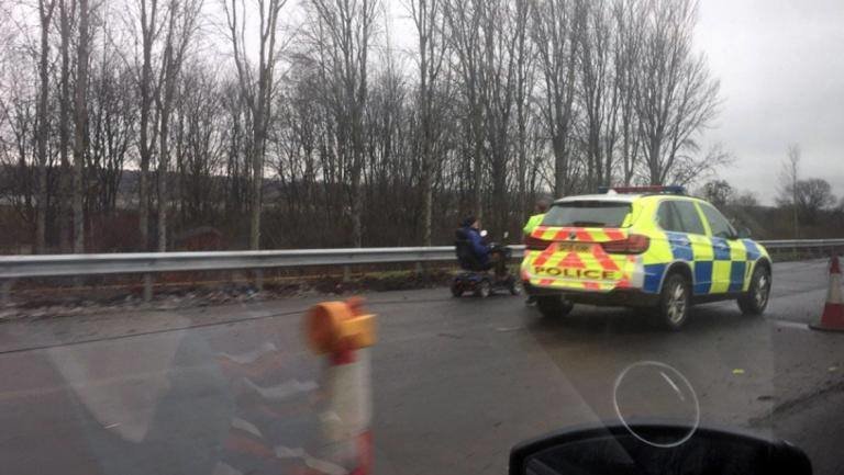 521912-pensionber-on-mobility-scooter-pulled-over-by-police-on-m74-image-with-permission-from-jamesfeeney