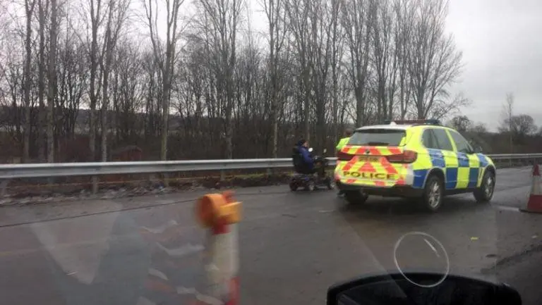 521912-pensionber-on-mobility-scooter-pulled-over-by-police-on-m74-image-with-permission-from-jamesfeeney