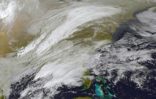 This NOAA/NASA GOES East satellite handout image taken on March 13, 2017 at 1400 UTC shows storm activity in the eastern United States.
Nearly half the United States was caught in an icy blast on March 13, 2017, with much of the East Coast bracing for what could be the worst winter storm of the year. Spring may be around the corner after an unusually warm winter throughout much of the region, but a powerful nor'easter called Winter Storm Stella is forming near the coast as two low pressure systems collide, burying a wide area from the central Appalachians to New England under up to 18 inches (46 centimeters) of snow. The National Weather Service cautioned that the storm could bring record-low temperatures late Monday into Tuesday, as well as "blizzard conditions in places, difficult travel and power outages."
 / AFP PHOTO / NOAA-NASA GOES Project / Handout / RESTRICTED TO EDITORIAL USE - MANDATORY CREDIT AFP PHOTO /NOAA-NASA GOES Project  - NO MARKETING - NO ADVERTISING CAMPAIGNS - DISTRIBUTED AS A SERVICE TO CLIENTS


