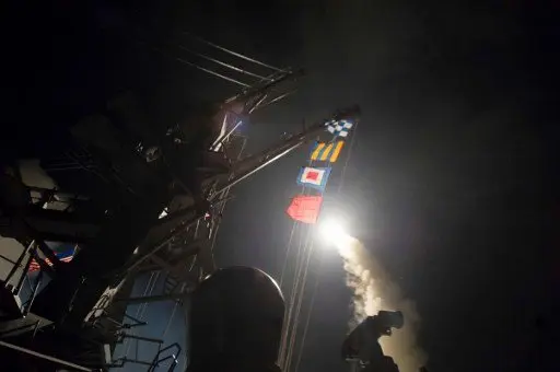 In this image released by the US Navy, the USS Ross fires a tomahawk land attack missile April 7, 2017, at a Syrian air force airfield .
US President Donald Trump ordered a massive military strike on a Syrian air base on Thursday in retaliation for a "barbaric" chemical attack he blamed on President Bashar al-Assad. / AFP PHOTO / US NAVY / Robert S. PRICE / RESTRICTED TO EDITORIAL USE - MANDATORY CREDIT "AFP PHOTO / US NAVY / Mass Communication Specialist 3rd Class Robert S. Price" - NO MARKETING NO ADVERTISING CAMPAIGNS - DISTRIBUTED AS A SERVICE TO CLIENTS