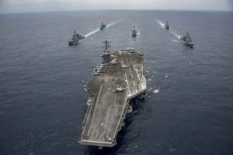 This US Navy handout photo shows Japan Maritime Self-Defense Force destroyers JS Ashigara (DDG 178) and JS Samidare (DD 106), the Arleigh Burke-class guided-missile destroyers USS Wayne E. Meyer (DDG 108) and USS Michael Murphy (DDG 112), Ticonderoga-class guided-missile cruiser USS Lake Champlain (CG 57) and Nimitz-class aircraft carrier USS Carl Vinson (CVN 70)as they transit the Philippine Sea on April 28, 2017.
The US Navy has patrolled the Indo-Asia-Pacific routinely for more than 70 years promoting regional peace and security. / AFP PHOTO / US NAVY / Z.A. Landers / RESTRICTED TO EDITORIAL USE - MANDATORY CREDIT "AFP PHOTO /US NAVY/Z.A.LANDERS" - NO MARKETING NO ADVERTISING CAMPAIGNS - DISTRIBUTED AS A SERVICE TO CLIENTS