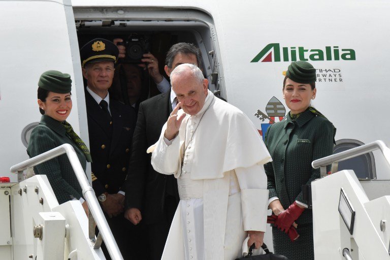 Pope Francis boards an Alitalia flight to Monte Real and the Sanctuary of Our Lady of Fatima in Portugal, on May 12, 2017 at the Fiumicino airport of Rome. Pope Francis is heading to Fatima today on a pilgrimage that will attract up to a million faithful and see the pontiff canonise two child shepherds who reported apparitions of the Virgin Mary 100 years ago. / AFP PHOTO / Andreas SOLARO