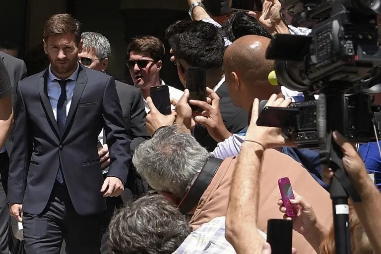 (FILES) This file photo taken on June 2, 2016 shows Barcelona's football star Lionel Messi (L) leaveing the courthouse on June 2, 2016 in Barcelona.
Spain's Supreme Court on May 24, 2017 confirmed a 21-month jail sentence and 2.09-million-euro ($2.25 million) fine imposed on Lionel Messi for tax fraud, months after the Barcelona football star lodged an appeal.
/ AFP PHOTO / LLUIS GENE
