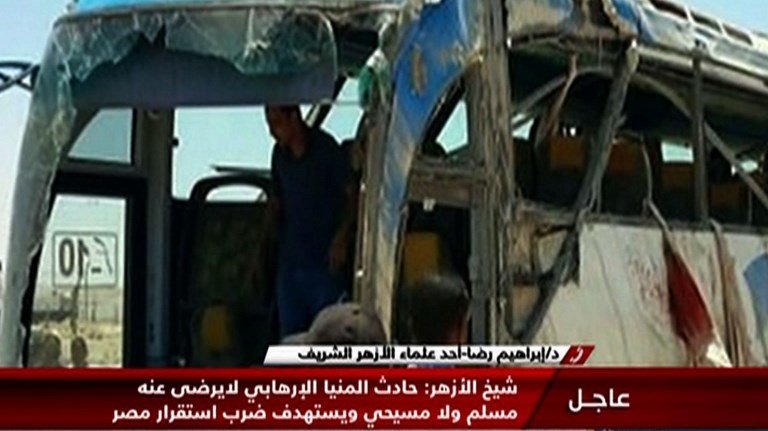 EDITORS NOTE: Graphic content / An image grab taken from Egypt's state-run Nile News TV channel on May 26, 2017 shows the remains of a bus that was attacked while carrying Egyptian Christians in Minya province, some 260 kms south of the capital Cairo, killing dozens people according to state media and the health ministry.
The attack followed church bombings in December and April claimed by the Islamic State (IS) jihadist group that killed dozens of Egypt's Coptic Christians. / AFP PHOTO / Nile News / TV Grab