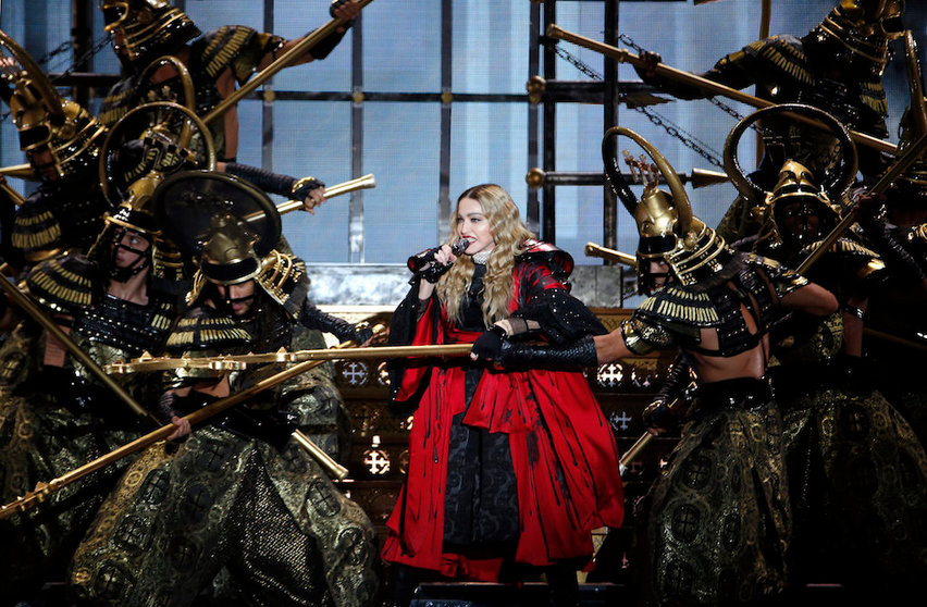 US singer Madonna performs during a concert at the AccorHotels Arena in Paris on December 9, 2015.  / AFP PHOTO / FRANCOIS GUILLOT