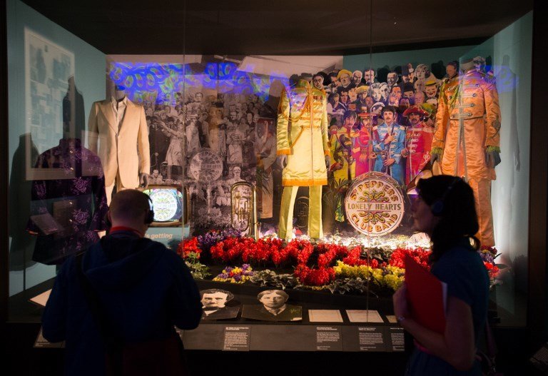 (FILES) This file photo taken on September 7, 2016 shows original and replica costumes from the British band The Beatles used on the album cover of Sgt. Pepper's Lonely Hearts Club Band on display during a photo-call for the "You Say You Want a Revolution? Records and Rebels 1966-70" exhbition at the V&A museum in central London.
The Beatles' "Sgt. Pepper" album revolutionized not just music but cover art, enigmatically depicting 61 (mostly) famous people. Fifty years later, only five of them are still alive. At a time when album covers were usually glossy photos of artists, "Sgt. Pepper's Lonely Hearts Club Band" was a marvel for fans who were sent hunting for deeper meanings in an era before Google searches.The 1967 album showed The Beatles dressed up as a military brass band surrounded by sketches, photos or wax figures of 57 people from writers to Indian gurus to Karl Marx.
 / AFP PHOTO / Daniel Leal-Olivas / RESTRICTED TO EDITORIAL USE - MANDATORY MENTION OF THE ARTIST UPON PUBLICATION - TO ILLUSTRATE THE EVENT AS SPECIFIED IN THE CAPTION
-TO GO WITH AFP STORY BY SHAUN TANDON-"After 50 years, handful of survivors on 'Sgt. Pepper' cover"