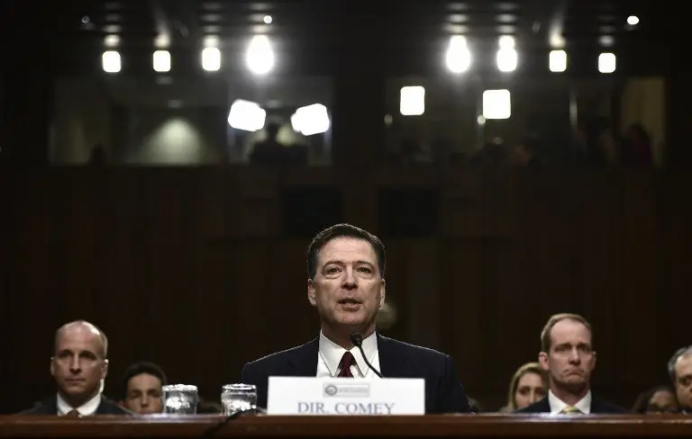 Former FBI Director James Comey testifies during a US Senate Select Committee on Intelligence hearing on Capitol Hill in Washington, DC, June 8, 2017.
Fired FBI director James Comey took the stand Thursday in a crucial Senate hearing, repeating explosive allegations that President Donald Trump badgered him over the highly sensitive investigation Russia's meddling in the 2016 election. / AFP PHOTO / Brendan Smialowski