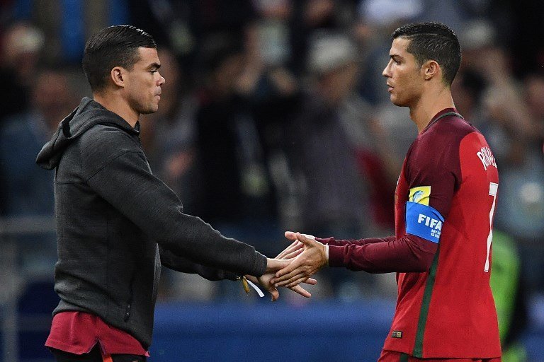 Portugal's defender Pepe (L) and Portugal's forward Cristiano Ronaldo react after being defeated in the 2017 Confederations Cup semi-final football match between Portugal and Chile at the Kazan Arena in Kazan on June 28, 2017. / AFP PHOTO / Kirill KUDRYAVTSEV