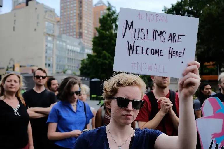 NEW YORK, NY - JUNE 29: Recent Immingrants join activists for an evening protest in Manhattan hours before a revised version of President Donald Trump's travel ban that was approved by the Supreme Court is to take effect on June 29, 2017 in New York City. Hundreds of protesters marched through the streets demanding and end to the ban which prohibits for 90 days the entry of travellers from six predominantly Muslim countries: Iran, Libya, Somalia, Sudan, Syria and Yemen. The court granted an exception for people with 'bona fide relationships' in the United States.   Spencer Platt/Getty Images/AFP