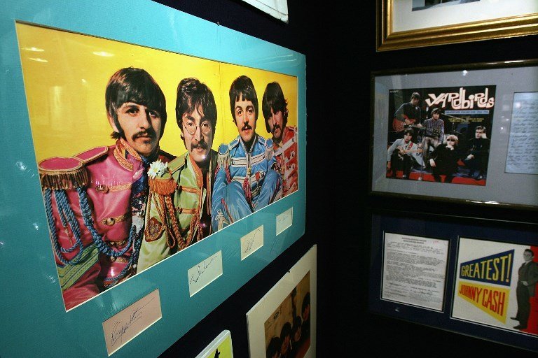 Beatles memorabilia stands on display at Christie's 10 December  2004 in New York City. Christie's, in a partnership with Julien's, will hold a Rock & Roll and Entertainment Memorabilia auction Friday, 17 December  2004. The sale, which will include such items as guitars owned by Beatle George Harrison, an Academy Award from 1941 for Best Picture, interview tapes of John Lennon, letters from Kurt Cobain to Courtney Love and numerous Elvis memorabilia, is expected to realize in the region of $3 million.  (Photo by Spencer Platt/Getty Images/AFP)  FOR NEWSPAPERS AND TV USE ONLY  --  MORE IMAGES AVAILABLE ON IMAGEFORUM