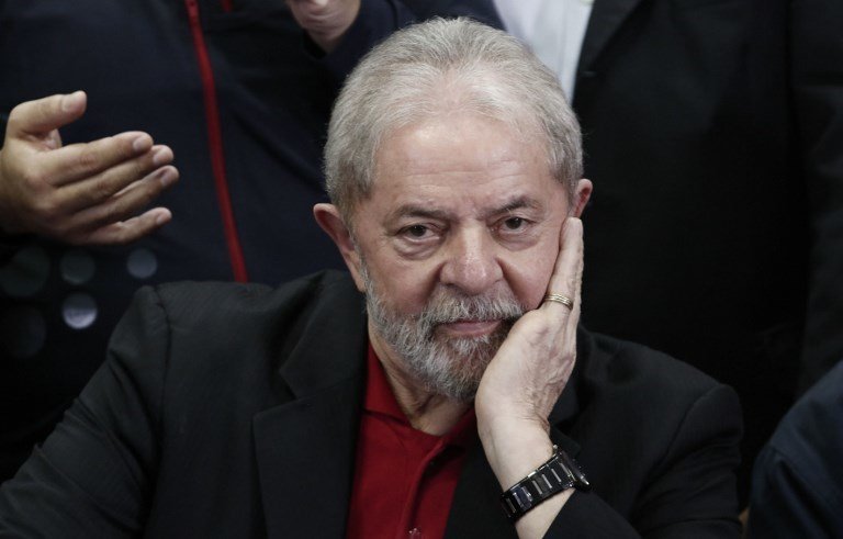 Former Brazilian president Luiz Inacio Lula Da Silva gestures during a press conference in Sao Paulo, Brazil on July 13, 2017.
Brazil's former president Luiz Inacio Lula da Silva said on Thursday -- a day after he was convicted and sentenced for graft -- that judges and political opponents were "destroying democracy." In his first public reaction to the verdict handed down on Wednesday, Lula implied the judgment was aimed at preventing him being a comeback candidate in presidential elections next year. "They're destroying democracy in our country," he told reporters in Sao Paulo.

 / AFP PHOTO / Miguel SCHINCARIOL