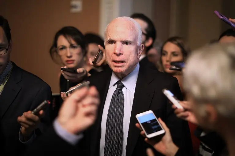 (FILES) This file photo taken on July 13, 2017 shows Sen. John McCain (R-AZ) leaving a meeting where a new version of a GOP healthcare bill was unveiled to Republican senators at the US Capitol in Washington, DC.
US Senator John McCain has been diagnosed with brain cancer, his office said July 19, 2017. / AFP PHOTO / GETTY IMAGES NORTH AMERICA / CHIP SOMODEVILLA