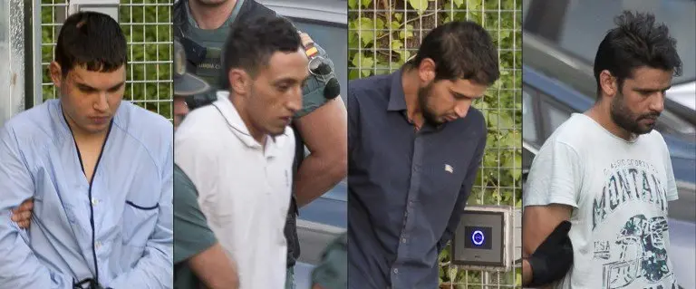 (COMBO) This combination of pictures created on August 22, 2017 shows (from L)
Mohamed Houli Chemlal, Driss Oukabir, Salah El Karib, and Mohamed Aallaa, suspected of involvement in the terror cell that carried out twin attacks in Barcelona and Cambrils, escorded by Spanish Civil Guards from a detention center in Tres Cantos, near Madrid, on August 22, 2017 before being tranferred to the National Court.
Under heavy security, police vans entered the National Court, which deals with terrorism cases, where a judge will question them and decide what -- if any -- charges to press against them over the vehicle attacks that left 15 dead and 120 injured. / AFP PHOTO / STRINGER
