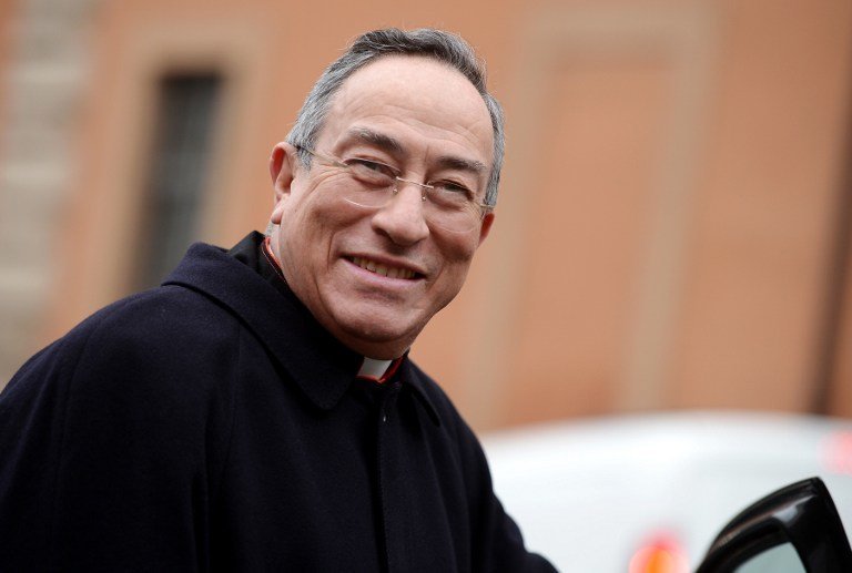 Honduras' cardinal Oscar Andres Rodriguez Maradiaga arrives for an afternoon meeting of pre-conclave on March 8, 2013 at the Vatican. The next pope's ideal profile began to take shape on Tuesday as cardinals held a second day of pre-conclave talks -- a man with pastoral experience, missionary energy and few ties to the Vatican's unruly government.    AFP PHOTO / FILIPPO MONTEFORTE