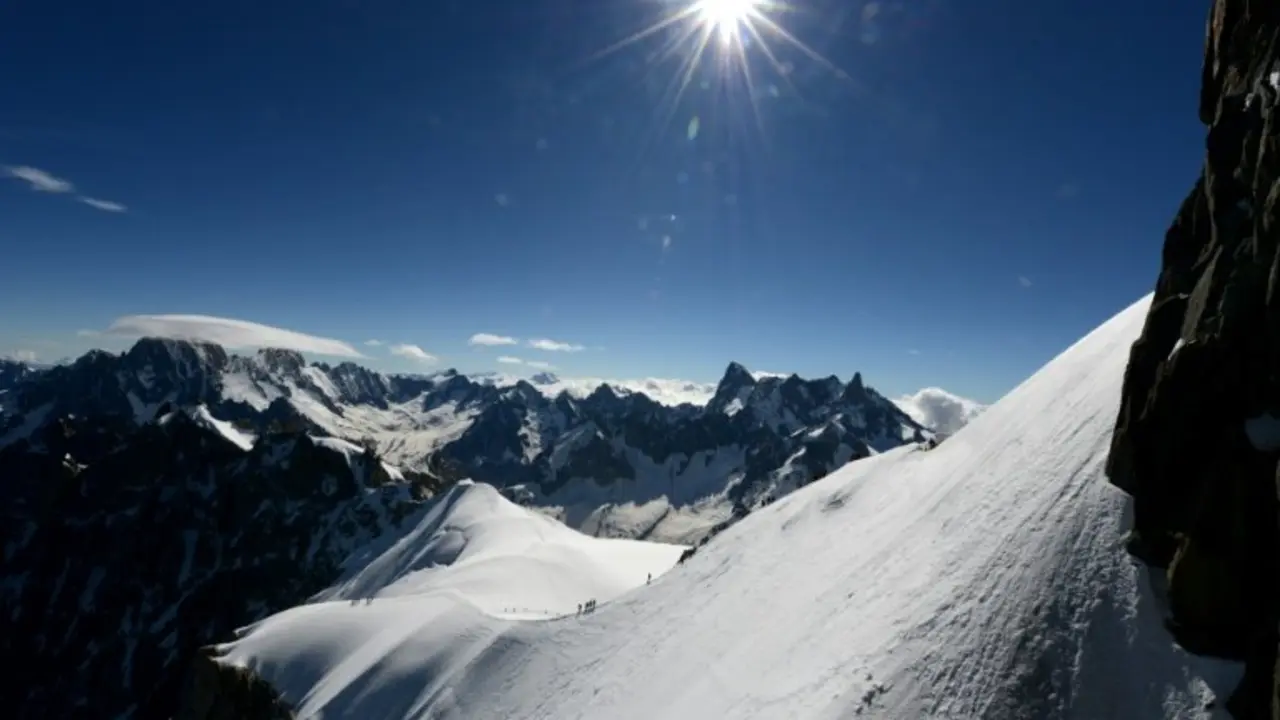 <p>Alpinists walk on the Mont-Blanc Massif above the vallee blanche in the French Alps on June 29, 2016.</p>