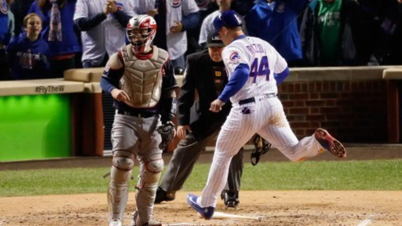 CHICAGO, IL - OCTOBER 30: Anthony Rizzo #44 of the Chicago Cubs scores a run past Roberto Perez #55 of the Cleveland Indians in the fourth inning in Game Five of the 2016 World Series at Wrigley Field on October 30, 2016 in Chicago, Illinois.   Jamie Squire/Getty Images/AFP