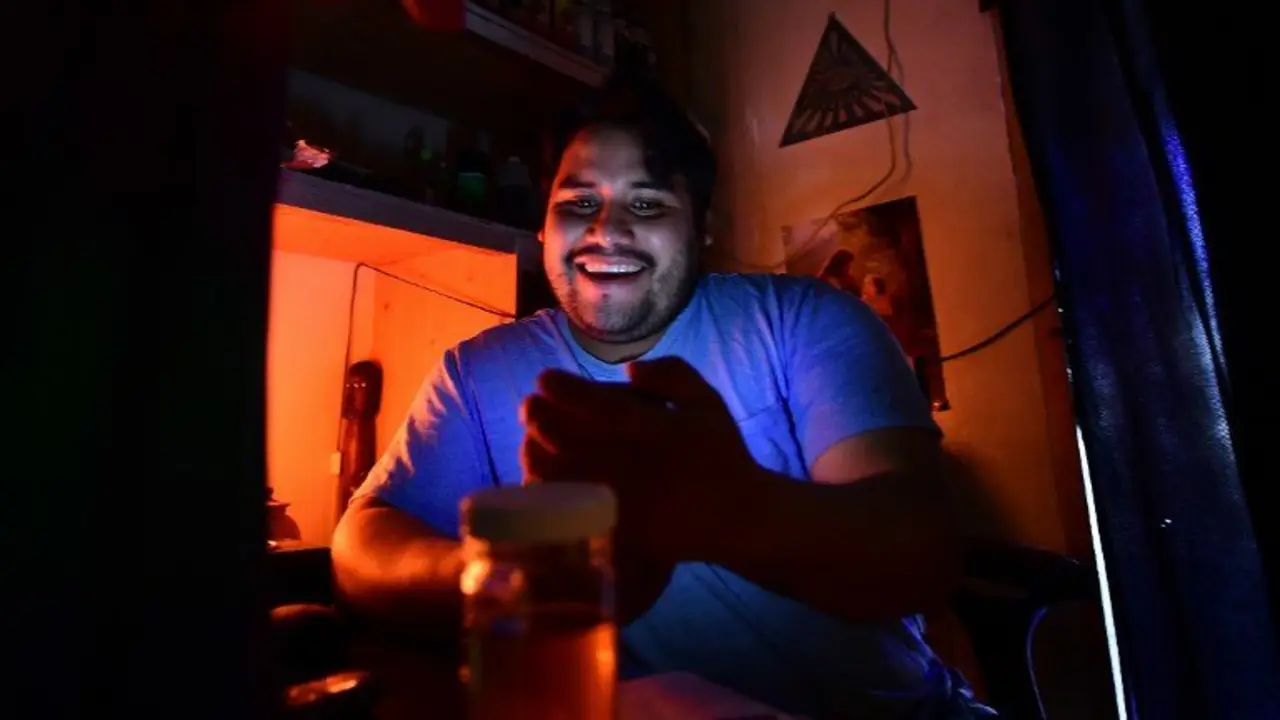 Lazaro Paz, owner and healer at Botanica Julika, sits in his office in Los Angeles on November 4, 2016. 
Paz is seeing an unusual request from his costumer: calm their anxiety about US Republican presidential candidate Donald Trump and his immigration policy.  / AFP PHOTO / Frederic J. Brown