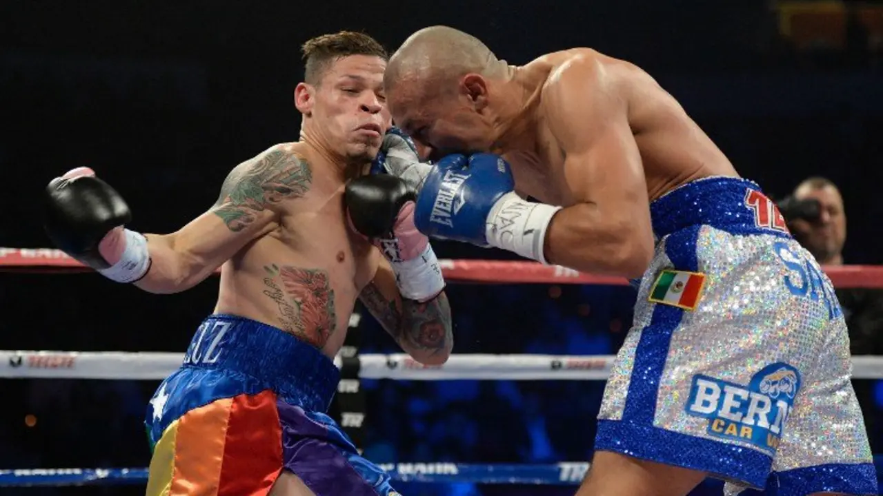 LAS VEGAS, NV - OCTOBER 12: Orlando Salido (R) lands a right to the head of Orlando Cruz during their WBO featherweight championship bout at the Thomas & Mack Center on October 12, 2013 in Las Vegas, Nevada.   Jeff Bottari/Getty Images/AFP