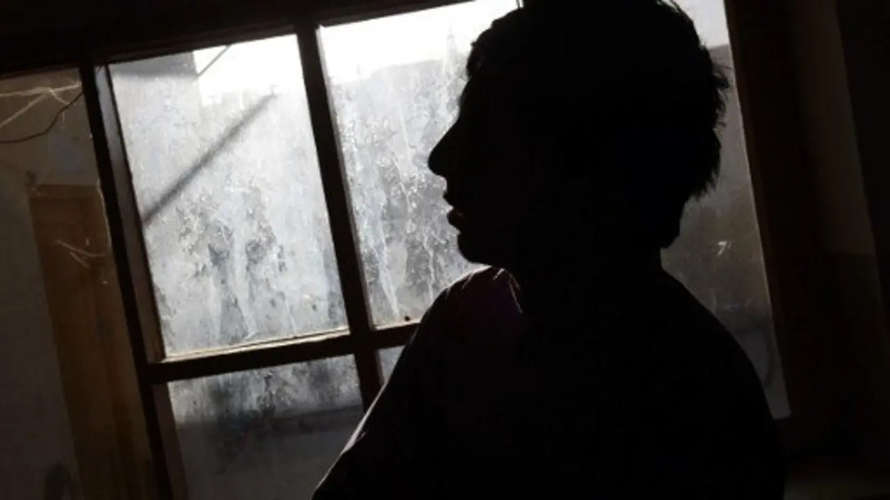This photograph taken on October 6, 2016 shows Bashir, a relative of a "bacha bazi" victim, a teenage boy, looks on during an interview with AFP in Lashkar Gah of Helmand province.
Quivering with quiet rage, Shirin holds a photo of his teenage brother-in-law, who now lives as the plaything of policemen, just one victim of a hidden epidemic of kidnappings of young boys for institutionalised sexual slavery in Afghanistan. Shirin is among 13 families AFP traced and interviewed across three Afghan provinces who said their children were taken for the pervasive practice of "bacha bazi", or paedophilic exploitation, in Western-backed security forces. Their testimonies shine a rare spotlight on the anguished, solitary struggles to free sons, nephews and cousins from a tradition of culturally-sanctioned enslavement and rape. / AFP PHOTO / Wakil KOHSAR / To go with Afghanistan unrest children paedophilia police, FOCUS by Anuj CHOPRA