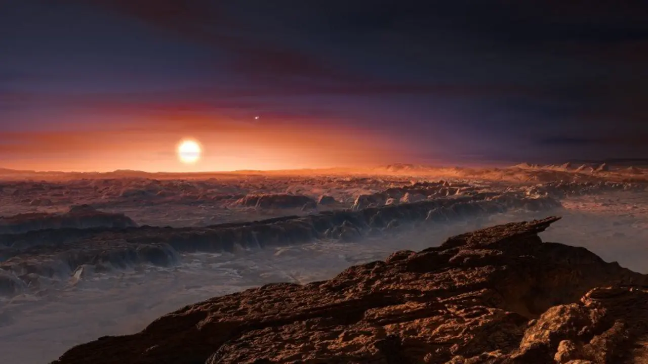 A hand out image made available by the European Southern Observatory on August 24 2016, shows an artist's impression of a view of the surface of the planet Proxima b orbiting the red dwarf star Proxima Centauri, the closest star to the Solar System. The double star Alpha Centauri AB also appears in the image to the upper-right of Proxima itself. Proxima b is a little more massive than the Earth and orbits in the habitable zone around Proxima Centauri, where the temperature is suitable for liquid water to exist on its surface.
 Scientists on August 24, 2016 announced the discovery of an Earth-sized planet orbiting the star nearest our Sun, opening up the glittering prospect of a habitable world that may one day be explored by robots. Named Proxima b, the planet is in a "temperate" zone compatible with the presence of liquid water -- a key ingredient for life. 
 / AFP PHOTO / EUROPEAN SOUTHERN OBSERVATORY / M. Kornmesser