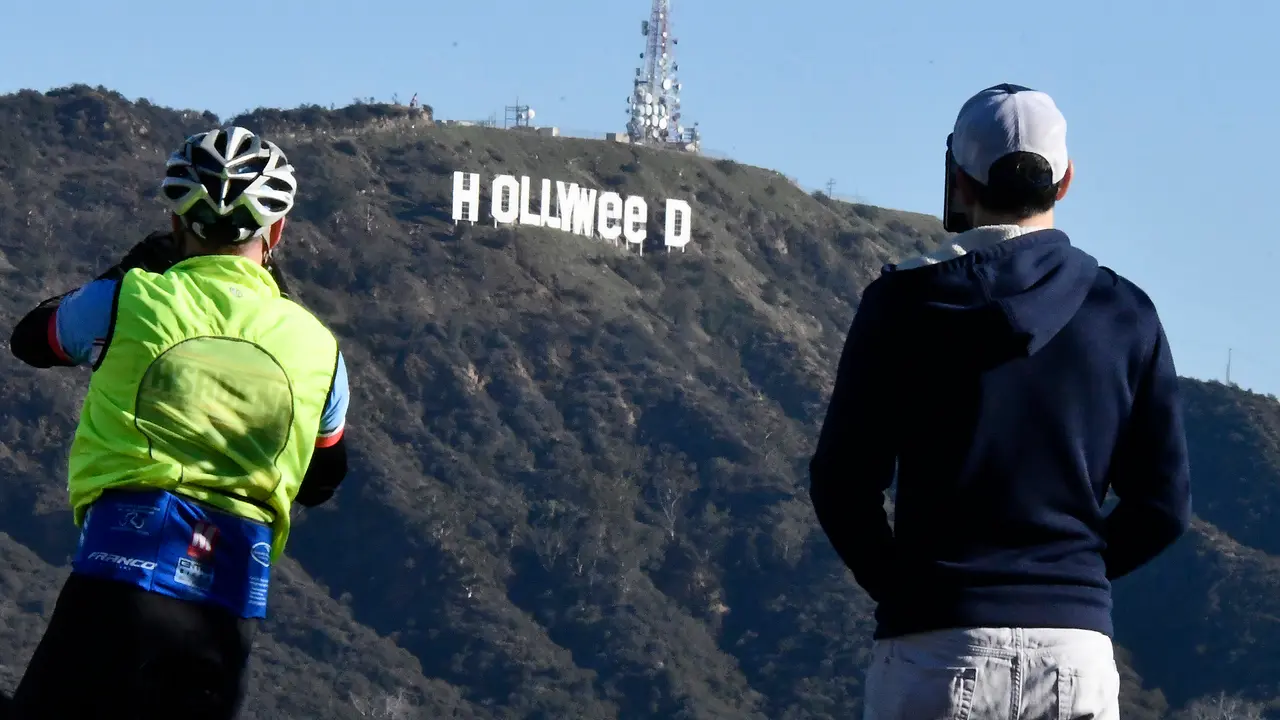 The famous Hollywood sign reads "Hollyweed" after it was vandalized, January 1, 2017.  
Police said unidentified thrill-seekers had climbed up and arranged tarps over the two letter "O's" to make them look like "E's," CBS affiliate KCAL reported. Each letter is 45 feet (13.7 meters) high, so the feat would have required not just bravado but considerable athleticism. 
 / AFP PHOTO / Gene Blevins