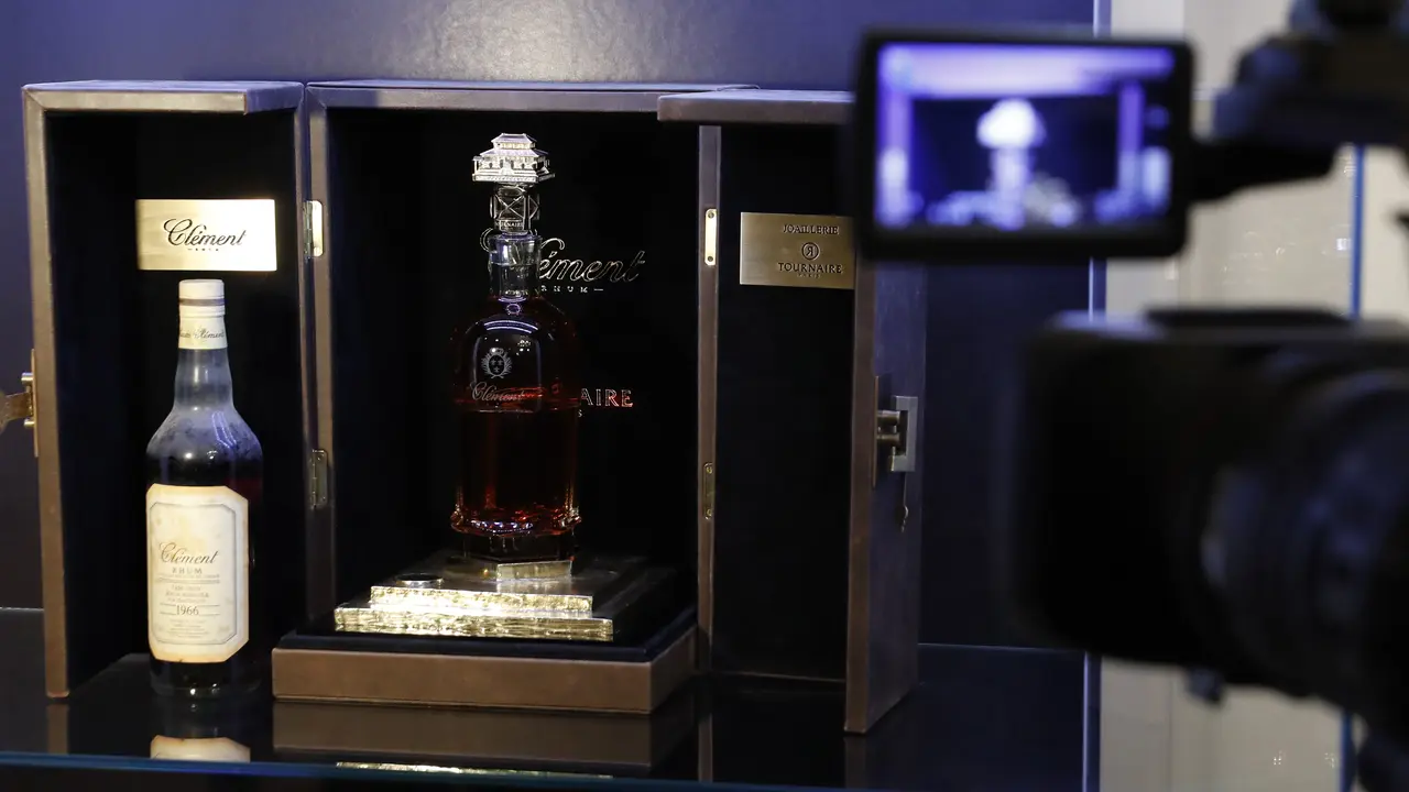 This picture taken on February 21, 2017, shows the world's most expensive rhum bottle sold in auction to raise money for an association fighting sick cells anemia, in Paris on February 21, 2017. / AFP PHOTO / PATRICK KOVARIK