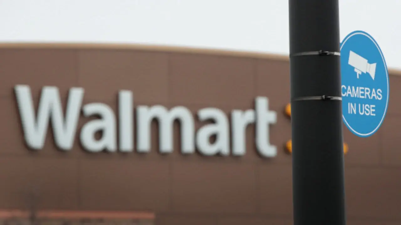 SKOKIE, IL - JANUARY 17:  A sign warns customers that cameras are monitoring the parking lot of a Walmart store on January 17, 2017 in Skokie, Illinois. Wal-Mart Stores Inc., the nation's largest employer, announced today that it plans to create approximately 10,000 retail jobs this year through the opening of 59 new, expanded and relocated Walmart and Sams Club facilities and e-commerce services.  (Photo by Scott Olson/Getty Images)