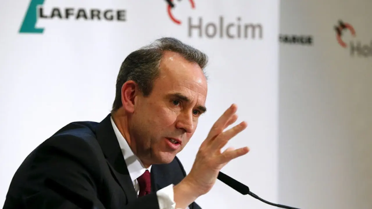 Future CEO Eric Olsen of the new merged entity LafargeHolcim smiles addresses a news conference in Zurich April 9, 2015. Cement maker Holcim has backed Olsen as chief executive following the Swiss firm's planned merger with French peer Lafarge. REUTERS/Arnd Wiegmann - RTR4WM7F