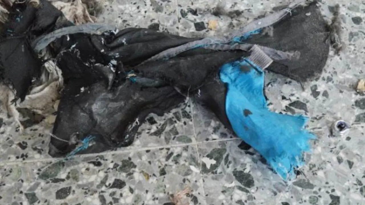 This photo obtained May 24, 2017 courtesy of The New York Times (http://nyti.ms/2rV9VcF) from British Law Enforcement, shows what the bomber in the Manchester terrorist attack appeared to have carried as a powerful explosive in a lightweight metal container concealed within a blue Karrimor backpack, and to have held a small detonator in his left hand, according to preliminary information gathered by British authorities in Manchester, England.
Twenty-two people were killed in Monday's suicide attack on a Manchester pop concert, including an eight-year-old girl and several parents who had come to collect their children. / AFP PHOTO / THE NEW YORK TIMES / Handout / RESTRICTED TO EDITORIAL USE - MANDATORY CREDIT "AFP PHOTO / THE NEW YORK TIMES/HANDOUT" - NO MARKETING NO ADVERTISING CAMPAIGNS - DISTRIBUTED AS A SERVICE TO CLIENTS

