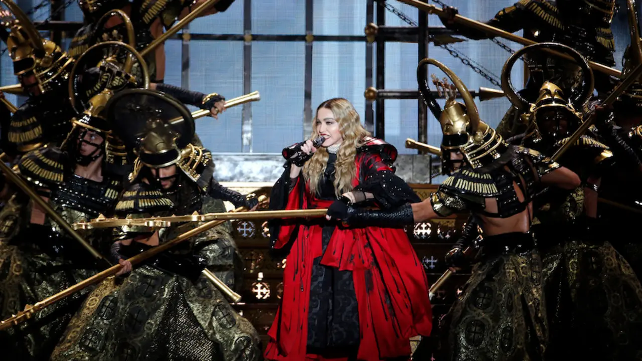 US singer Madonna performs during a concert at the AccorHotels Arena in Paris on December 9, 2015.  / AFP PHOTO / FRANCOIS GUILLOT