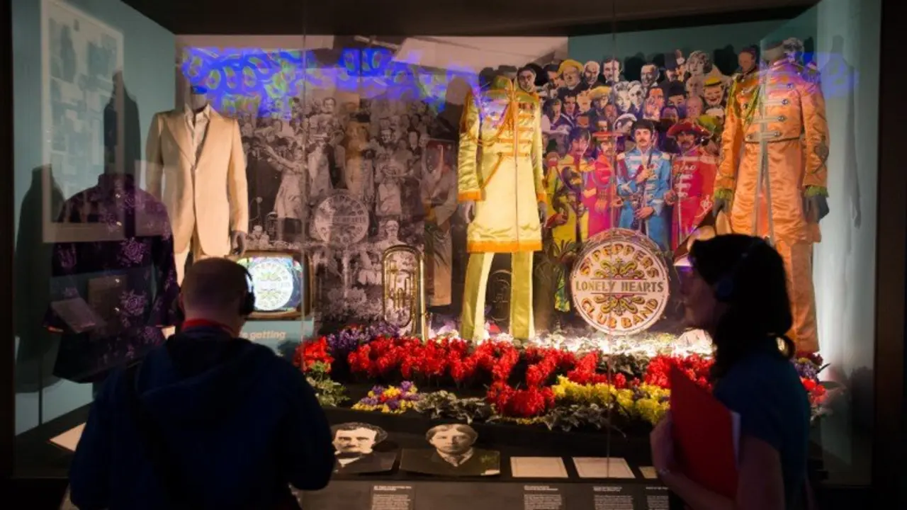 (FILES) This file photo taken on September 7, 2016 shows original and replica costumes from the British band The Beatles used on the album cover of Sgt. Pepper's Lonely Hearts Club Band on display during a photo-call for the "You Say You Want a Revolution? Records and Rebels 1966-70" exhbition at the V&A museum in central London.
The Beatles' "Sgt. Pepper" album revolutionized not just music but cover art, enigmatically depicting 61 (mostly) famous people. Fifty years later, only five of them are still alive. At a time when album covers were usually glossy photos of artists, "Sgt. Pepper's Lonely Hearts Club Band" was a marvel for fans who were sent hunting for deeper meanings in an era before Google searches.The 1967 album showed The Beatles dressed up as a military brass band surrounded by sketches, photos or wax figures of 57 people from writers to Indian gurus to Karl Marx.
 / AFP PHOTO / Daniel Leal-Olivas / RESTRICTED TO EDITORIAL USE - MANDATORY MENTION OF THE ARTIST UPON PUBLICATION - TO ILLUSTRATE THE EVENT AS SPECIFIED IN THE CAPTION
-TO GO WITH AFP STORY BY SHAUN TANDON-"After 50 years, handful of survivors on 'Sgt. Pepper' cover"